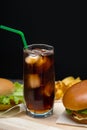 Tall glass of iced soda or coke with a straw Royalty Free Stock Photo