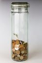 British pennies and pound coins in jar Royalty Free Stock Photo