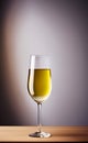 A tall glass of white wine on a wooden surface isolated close-up