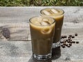 Tall glasses of cold coffee, latte, frappe, frappuccino in the garden or park Royalty Free Stock Photo
