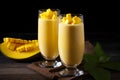 Tall glasses filled with a creamy mango lassi. Ai Generated.NO.03