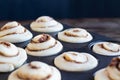 Tall Gourmet Cinnamon Buns Rising in Muffin Tin
