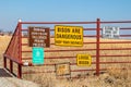 Tall Grass Prairie Oklahoma USA - Signs on metal fence at edge of buffalo reserve in NE Oklahoma - Bison are Dangerous