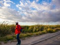 Tall grassy fields in Khayelitsha. Sun setting and reflecting off of blades of grass. Royalty Free Stock Photo