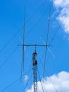 Tall ham radio antenna against cloudy sky Royalty Free Stock Photo