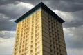 Tall high rise council flats against blue sky