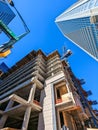 Tall highrise building under construction in a big city Royalty Free Stock Photo