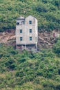 Tall home built on steep slope above Three Gorges Dam, China