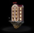 Tall hotel building on a severed piece of ground at night Royalty Free Stock Photo