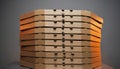 Tall Stack of Brown Cardboard Pizza Boxes on Dark Background Royalty Free Stock Photo