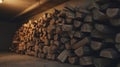 A tall indoor stack of neatly arranged split firewood Royalty Free Stock Photo