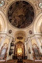 Tall interior of the baroque church with circle mural