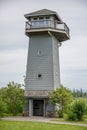 Tall look out lighthouse in field