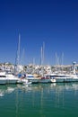 Tall luxury boats and yachts moored in Duquesa port in Spain on