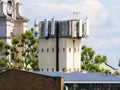 A tall mobile telecommunications tower with aerial antenna for mobile transmitters.