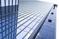 Tall modern business center building with glass office building and sky reflection Royalty Free Stock Photo