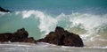 Tall morning wave breaks on rocks of Puako beach Royalty Free Stock Photo