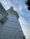 The tall mosque minaret is white Royalty Free Stock Photo