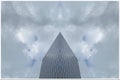 Tall office building in blue sky background with rising clouds Royalty Free Stock Photo