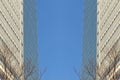 Tall office building in blue sky background with rising clouds Royalty Free Stock Photo