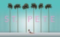 Tall palm trees and a sunbather on a white sand beach set the scene for the vacation destination St. Petersburg. This is an Royalty Free Stock Photo