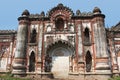 Tall pilasters, fluted pillars and scalloped arches in distintly european style blended with Indian elements,wall of old palace Da