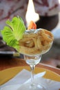 Tall pretty glass with appetizer of fresh Calamari