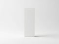 A tall, rectangular, white object casting a shadow on a plain background Royalty Free Stock Photo