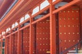 Tall red pillars and doors of historic Yakushi-ji temple in Nara, Japan. Royalty Free Stock Photo