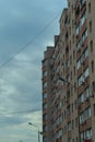 tall residential building against a gray sky