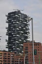 Tall residential building with balconies.