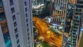 Tall residential buildings at JLT aerial night timelapse, part of the Dubai multi commodities centre mixed-use district. Royalty Free Stock Photo