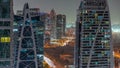 Tall residential buildings at JLT aerial night timelapse, part of the Dubai multi commodities centre mixed-use district. Royalty Free Stock Photo