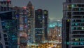 Tall residential buildings at JLT aerial night timelapse, part of the Dubai multi commodities centre mixed-use district. Royalty Free Stock Photo