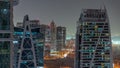 Tall residential buildings at JLT aerial night timelapse, part of the Dubai multi commodities centre mixed-use district. Royalty Free Stock Photo