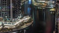 Tall residential buildings at JLT aerial night timelapse, part of the Dubai multi commodities centre mixed-use district. Royalty Free Stock Photo