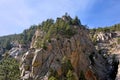 Tall Rocky Canyon With Pine Trees on a Sunny Day
