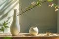 A tall sake bottle and a small sake cup next to it Royalty Free Stock Photo