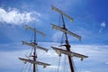 Tall ship mast with rolled sails Royalty Free Stock Photo