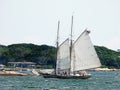 Masts and rigging of tall Schooner ship sailing in Gloucester bay Royalty Free Stock Photo