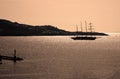 Tall ship silhouetted at sunset at Santorini