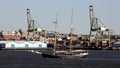 Tall ship underway in New York harbor, Brooklyn-side industrial Columbia Street Waterfront in the background Royalty Free Stock Photo