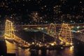 Tall ships docked at night in New York Harbor during the 100 year celebration for the Statue of Liberty, July 3, 1986