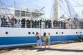 THE TALL SHIPS RACES KOTKA 2017. Kotka, Finland 16.07.2017. Ship Mir in the port of Kotka, Finland. Girls escort sailors. Royalty Free Stock Photo