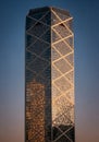 Tall skyscraper with distinctive crisscrossing external lattice structure, likely a diagrid Royalty Free Stock Photo