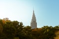 Tall skyscraper seen from a garden in Tokyo, Japan