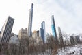 Tall Skyscrapers in the Midtown Manhattan Skyline seen from Central Park during Winter in New York City with Snow Royalty Free Stock Photo