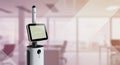A tall, sleek robot with a digital display screen in an office setting. The design features Royalty Free Stock Photo