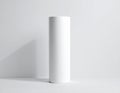 A single tall white cylindrical tube standing on a white surface with a shadow cylinder Royalty Free Stock Photo
