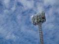 Tall spotlights tower with at sports stadium